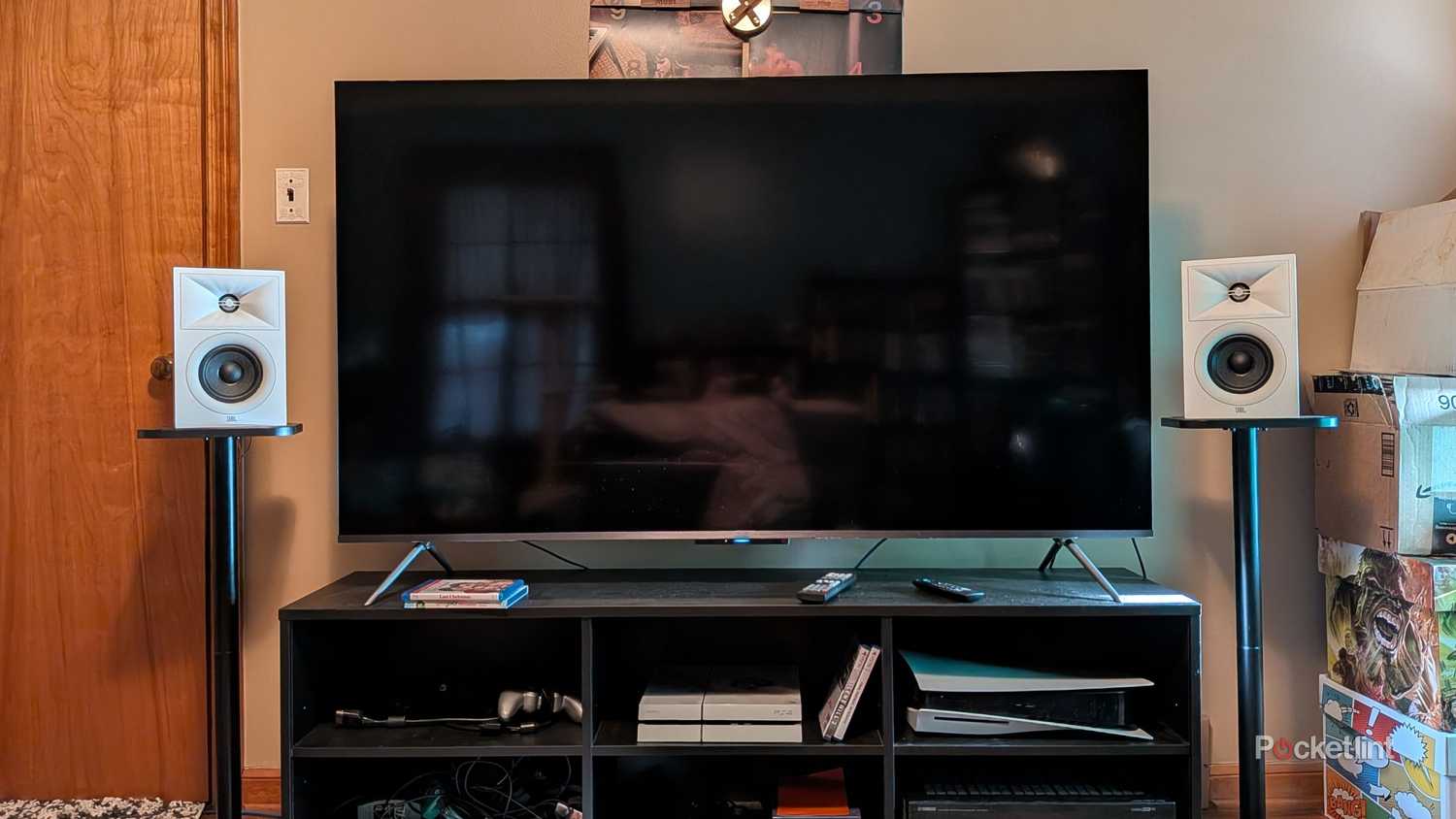 A Fire TV with two bookshelf speakers.