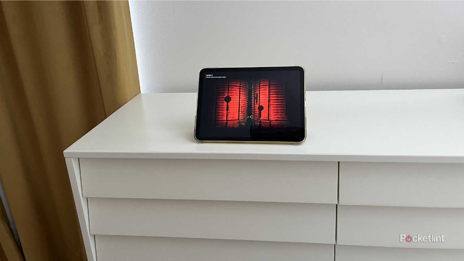 An iPad on a dresser streaming Netflix