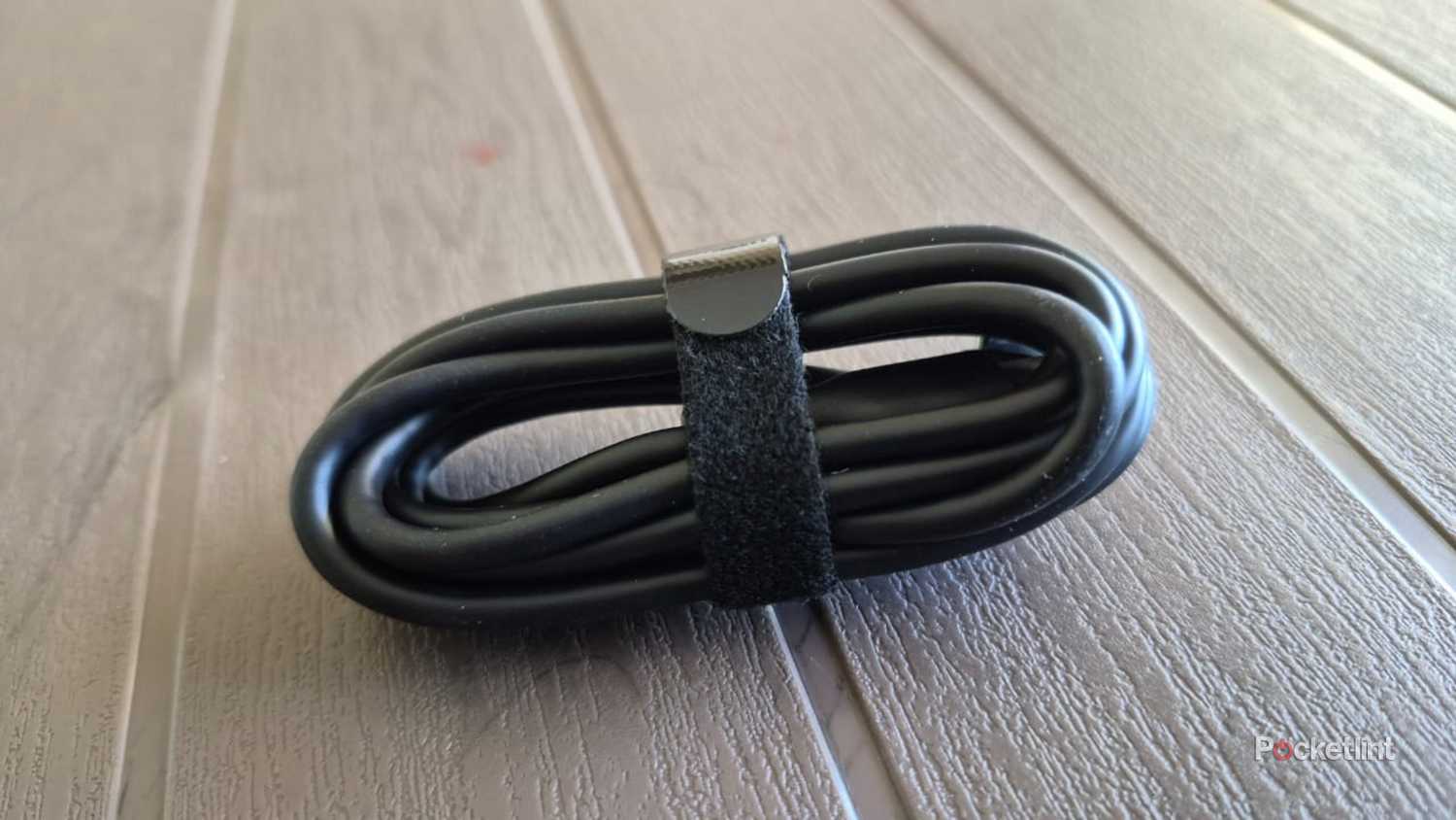 A cable folded using a velcro organizer.