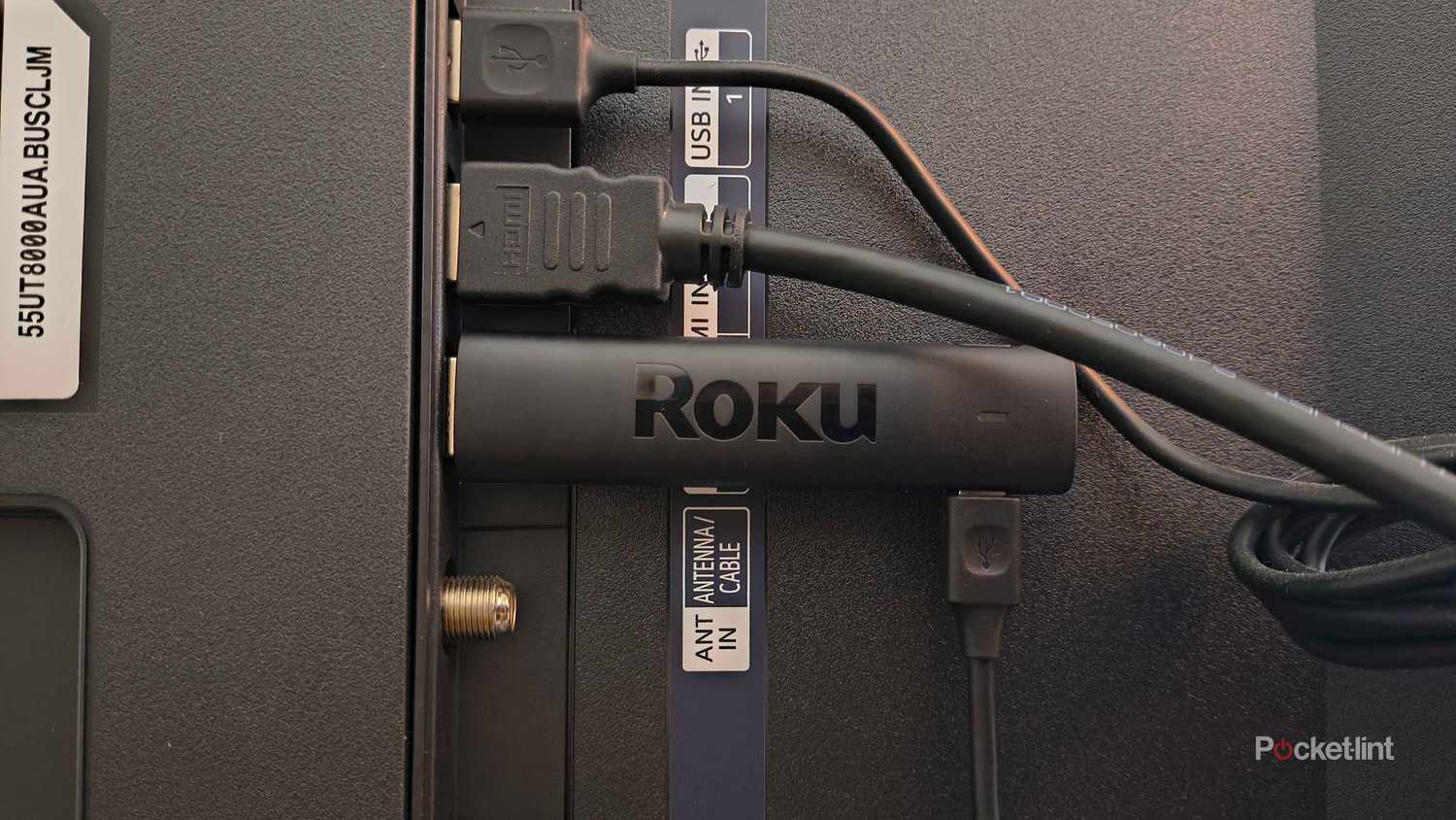 A Roku Streaming Stick 4K in an HDMI port on an LG TV. 