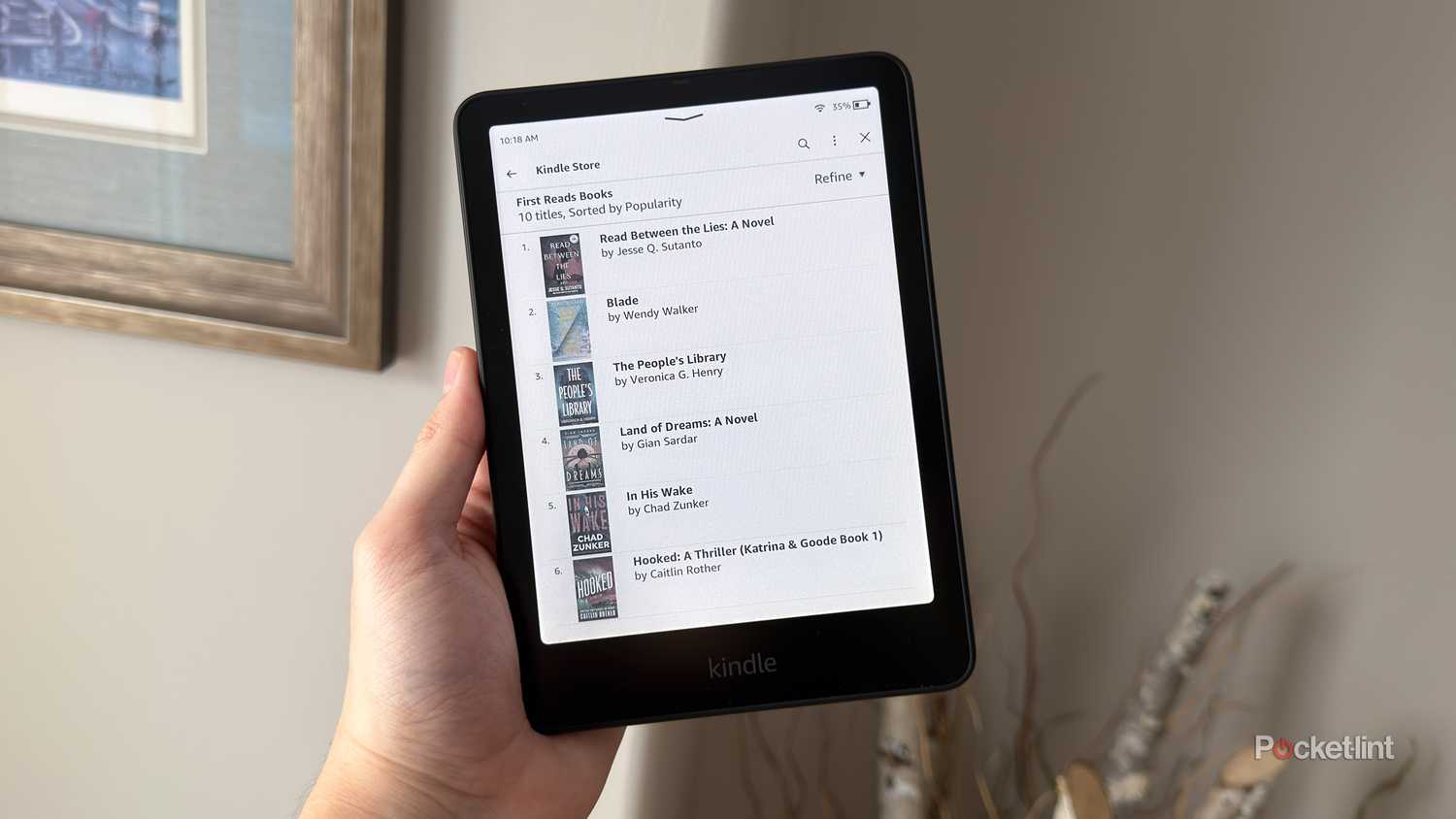 Holding up a Kindle Colorsoft.