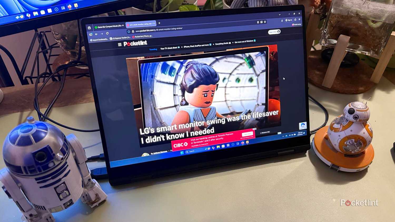 LG Gram Pro laptop with Pocket-lint webpage on screen.