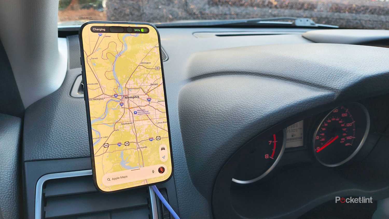 An iPhone on a dashboard of a 2016 Subaru Forester. 