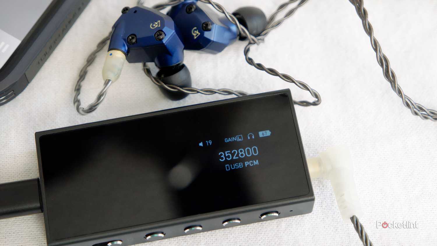 Questyle M18i DAC/Amp seen with a pair of Campfire Audio Mammoth IEMs
