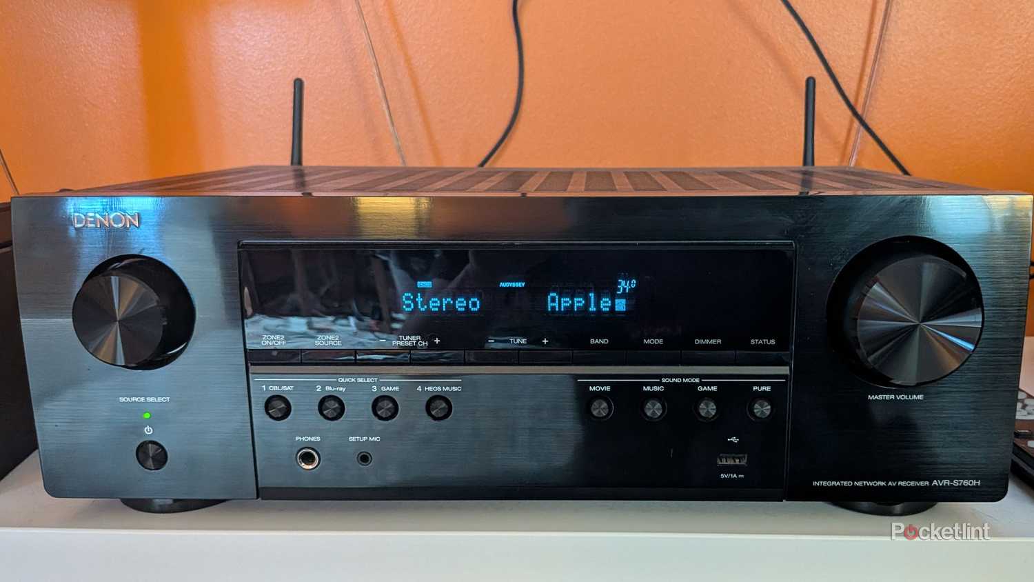 A black Denon 760h receiver.