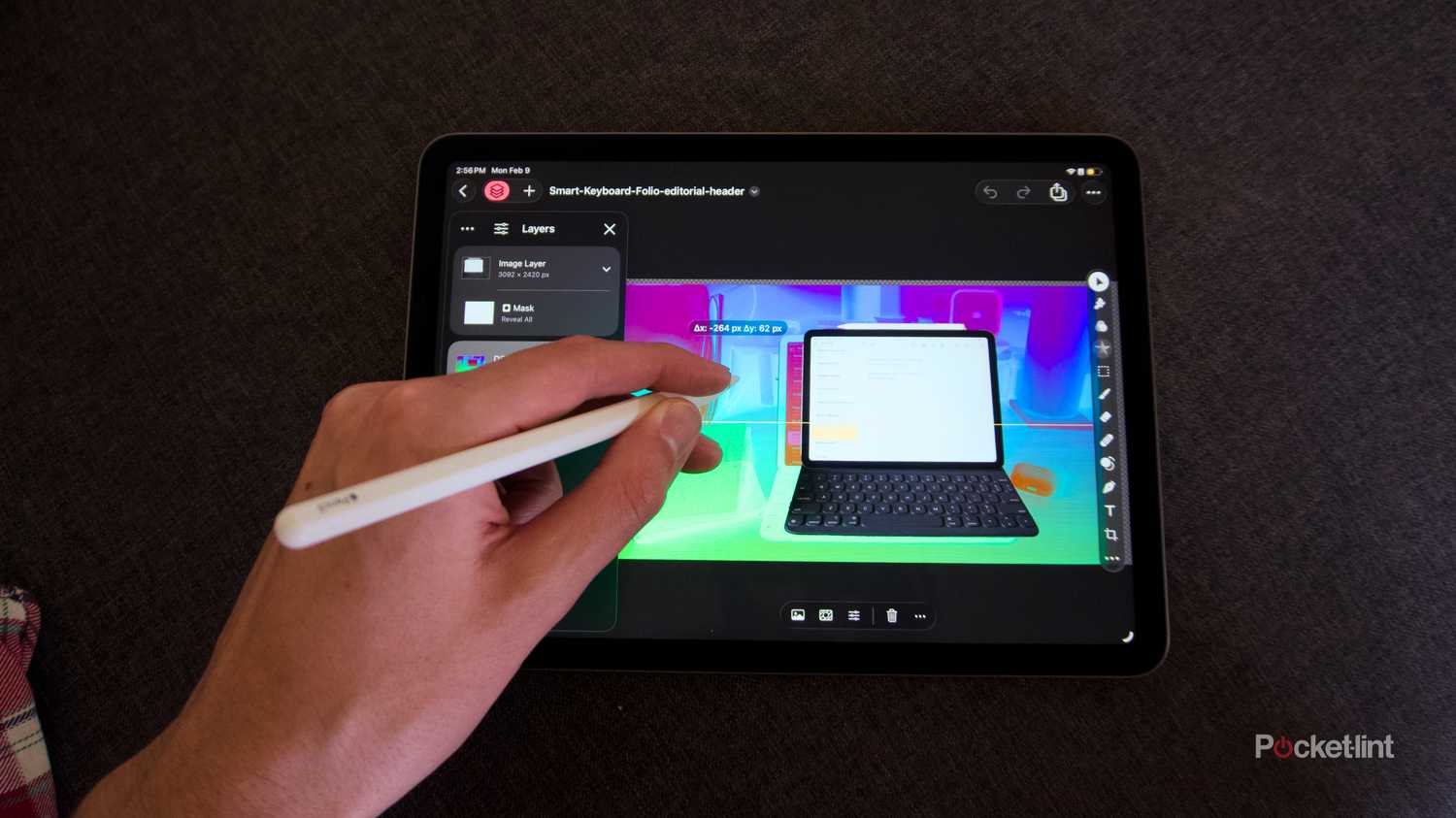 A hand using an Apple Pencil in Pixelmator Pro running on an iPad.