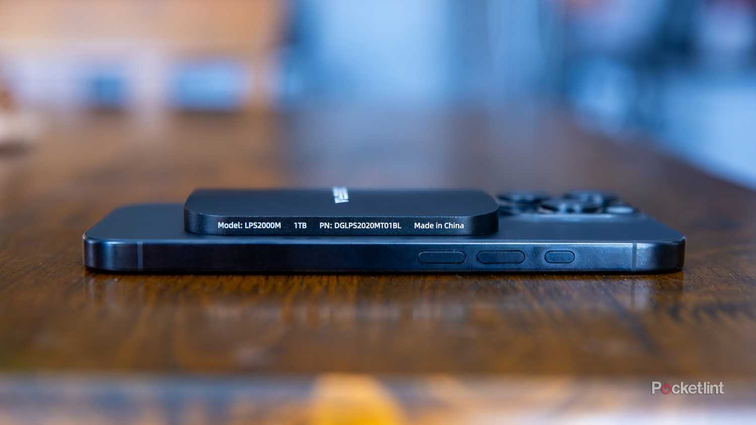 A still photo of the Digiera Endura SSD laying down on an iPhone 16 Pro. 