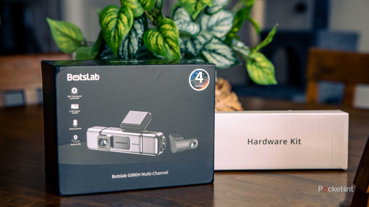 A still photo of the Botslab G980H dash camera shipment box and hardware kit.