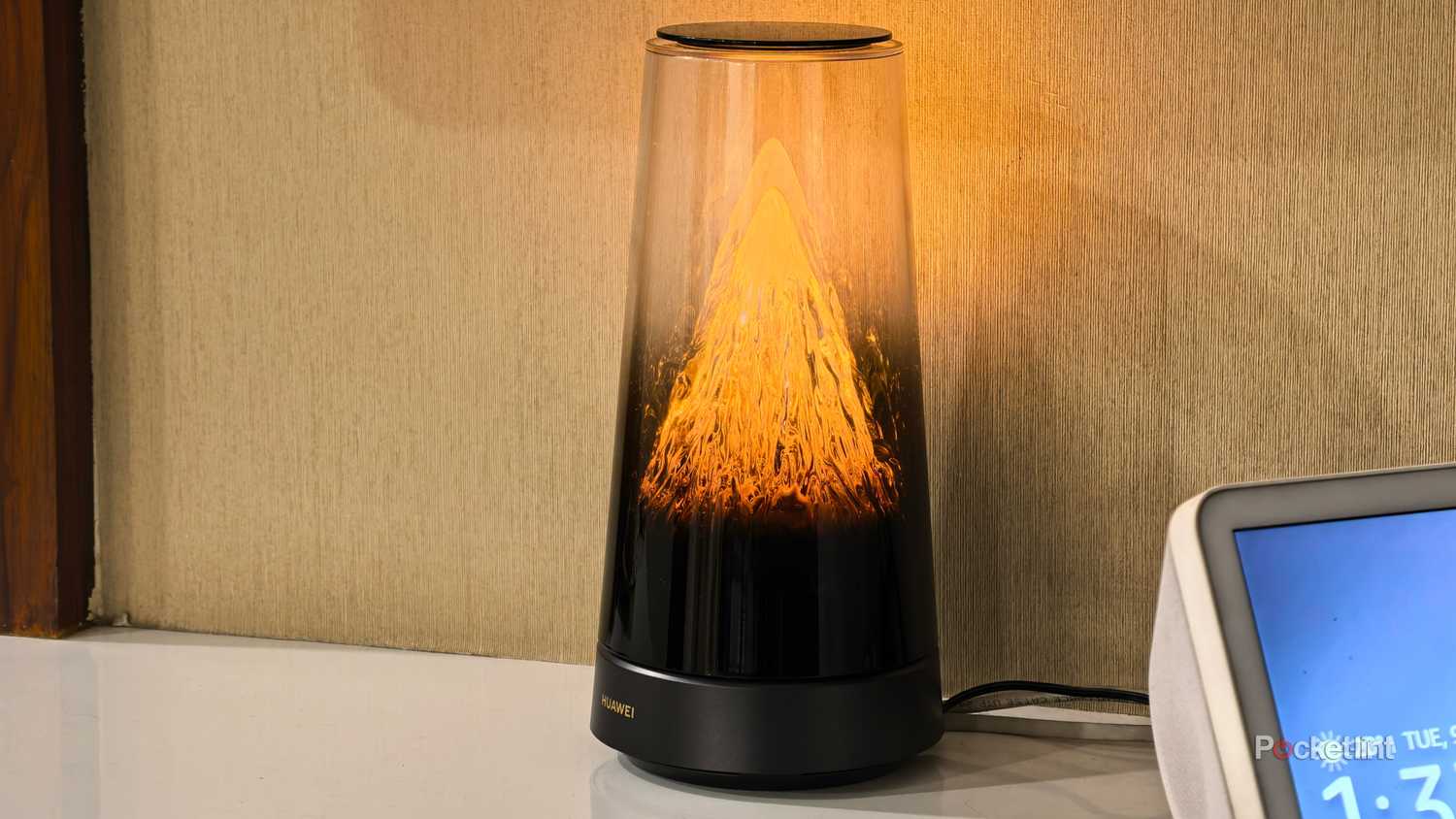 Huawei WiFi Mesh X3 Pro next to Amazon Echo Show