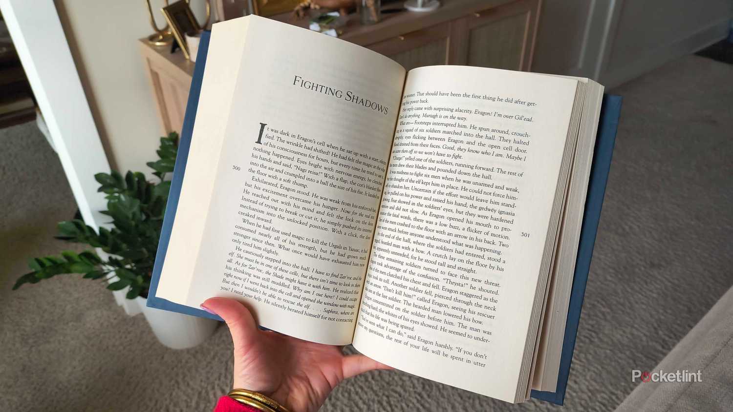 A hardcover copy of Eragon open.