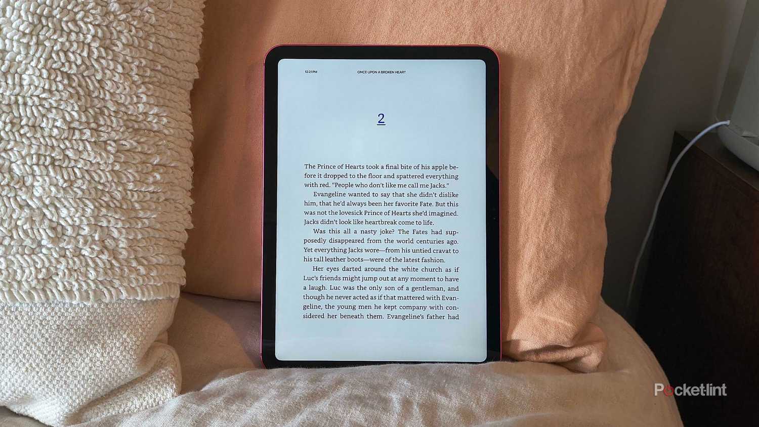 A base iPad with a Kindle book open. 