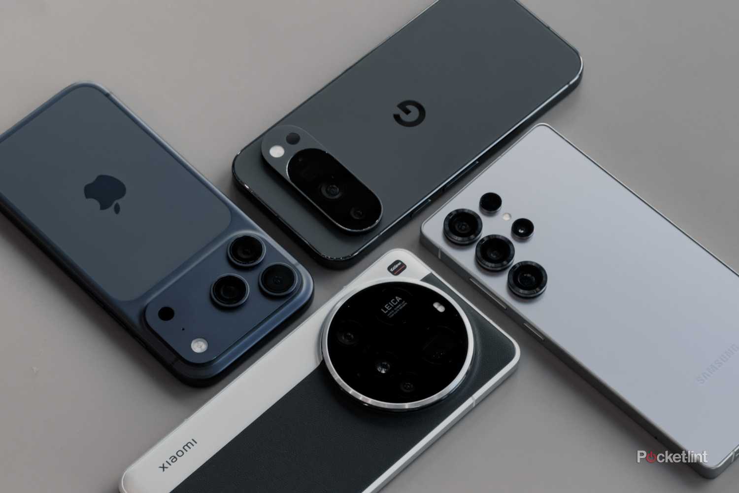 iPhone 17 Pro, Pixel 10 Pro, Xiaomi 15 Ultra and Galaxy S25 Ultra on grey table