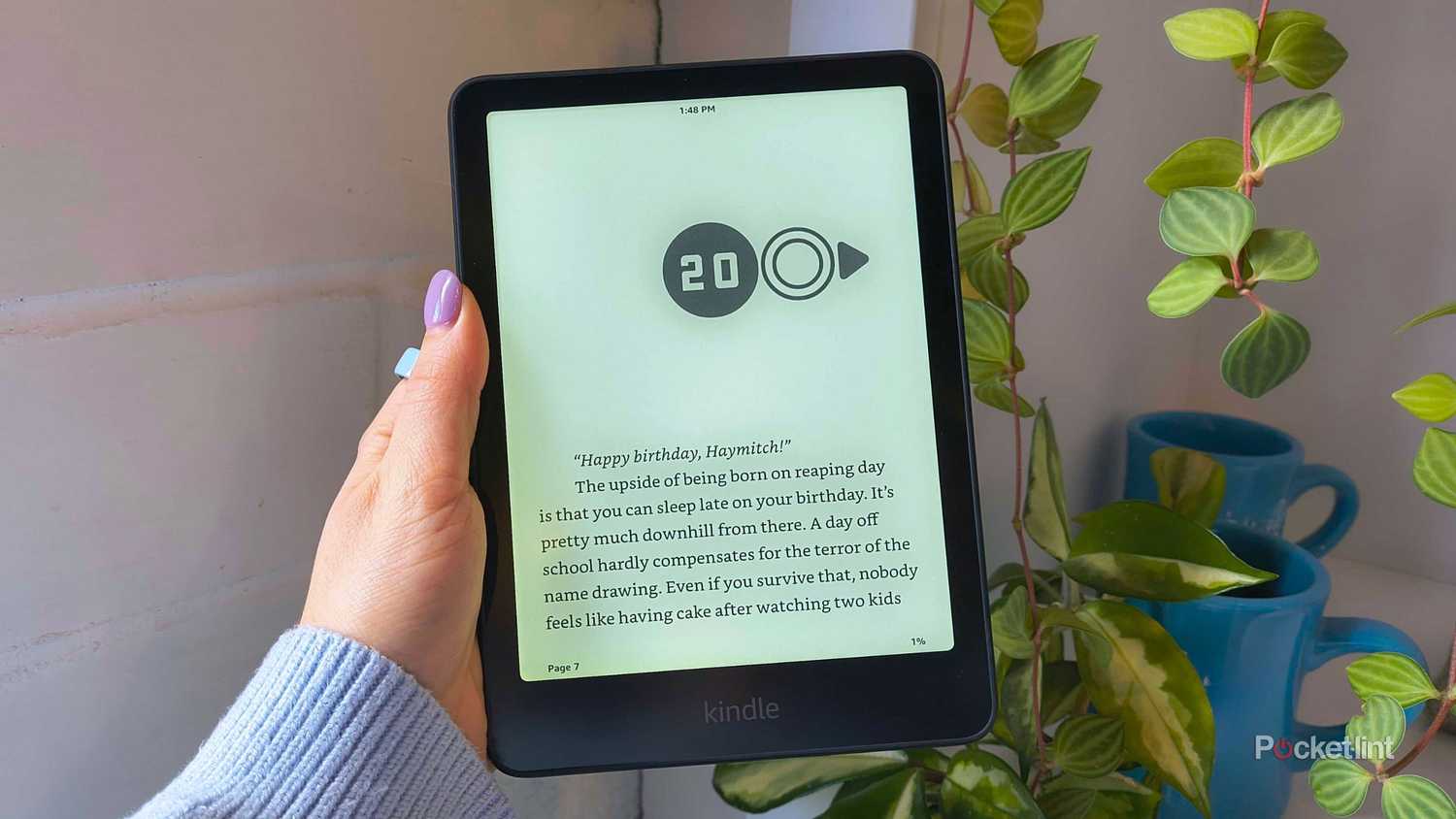 A Kindle Paperwhite beside a vine. 