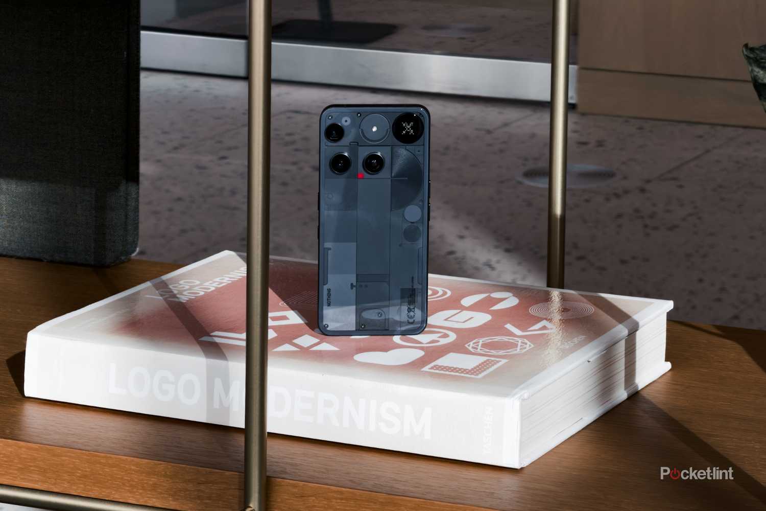 Nothing Phone (3) on a bookshelf