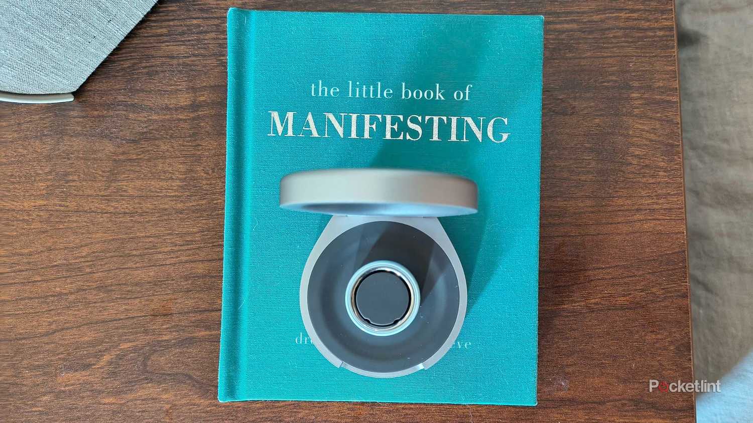 An Oura Ring Ceramic charging. 