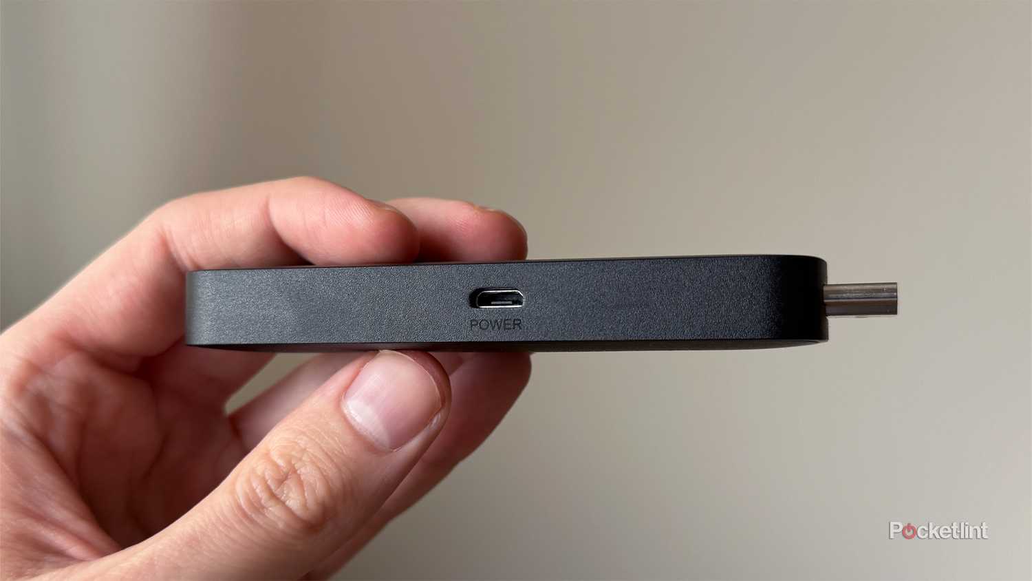 Person holding Fire TV Stick 4K Max.
