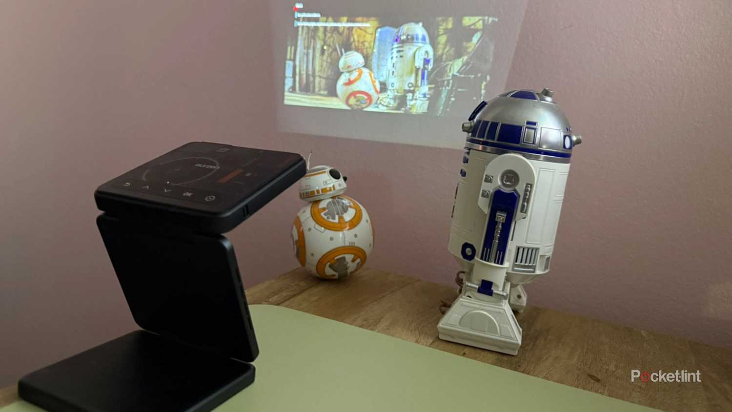 Aurzen Zip Projector playing Star Wars near droids.