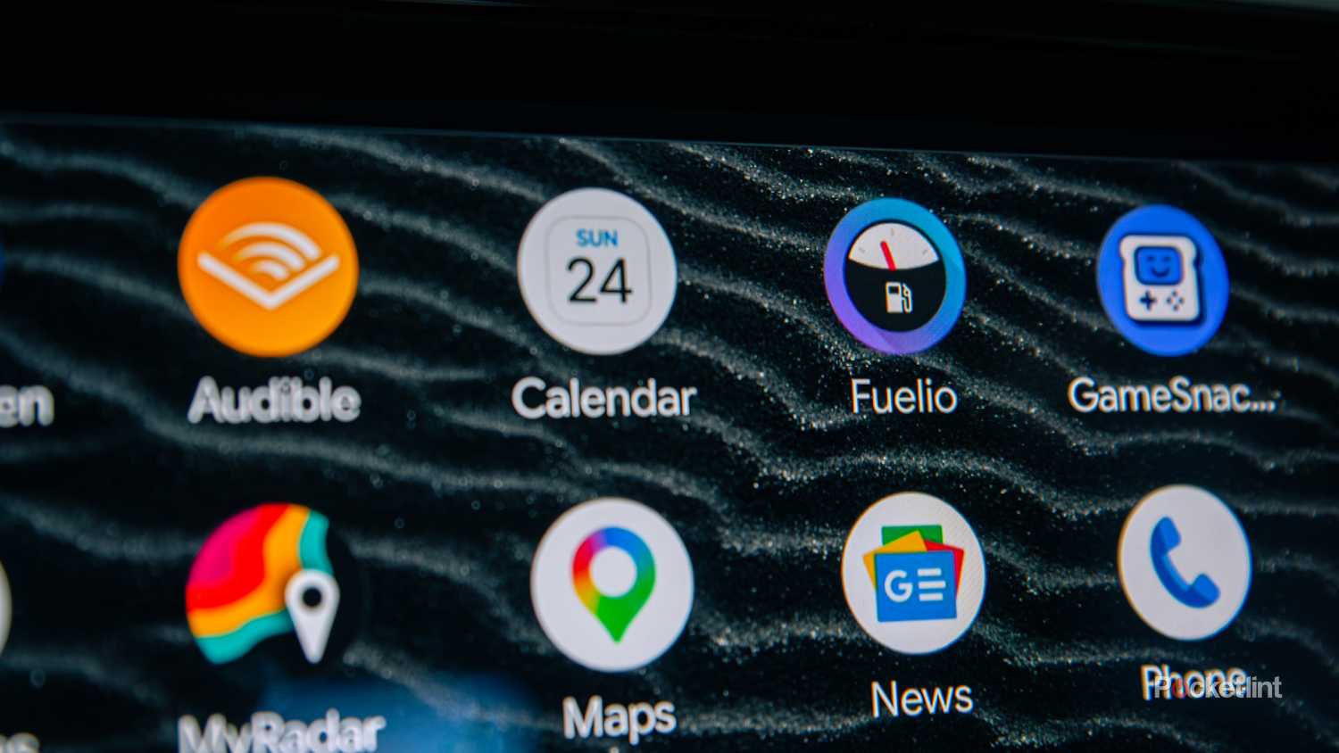 A still photo of the Fuelio logo on an Android Auto screen.