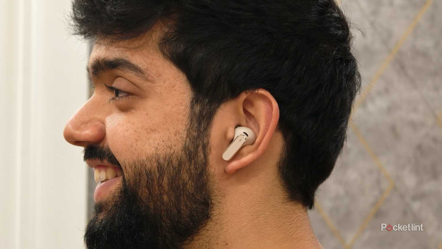 Author wearing the Huawei FreeBuds Pro 5 earbuds