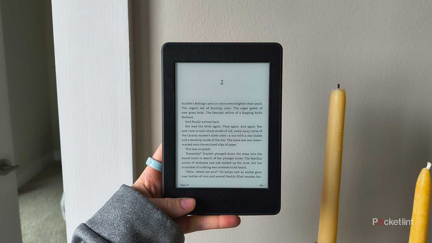 Someone holding a 2015 Kindle Paperwhite. 