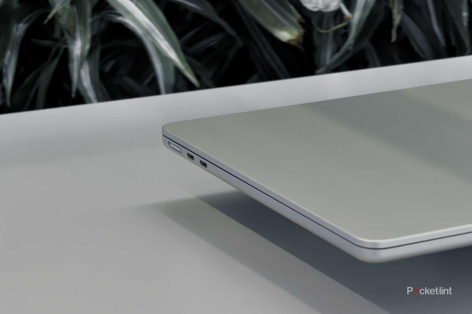 MacBook Air with M5 floating on a white table port close up