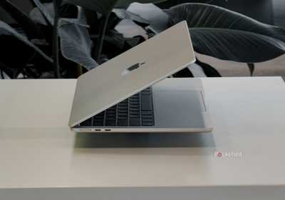 MacBook Air with M5 floating on a white table side view