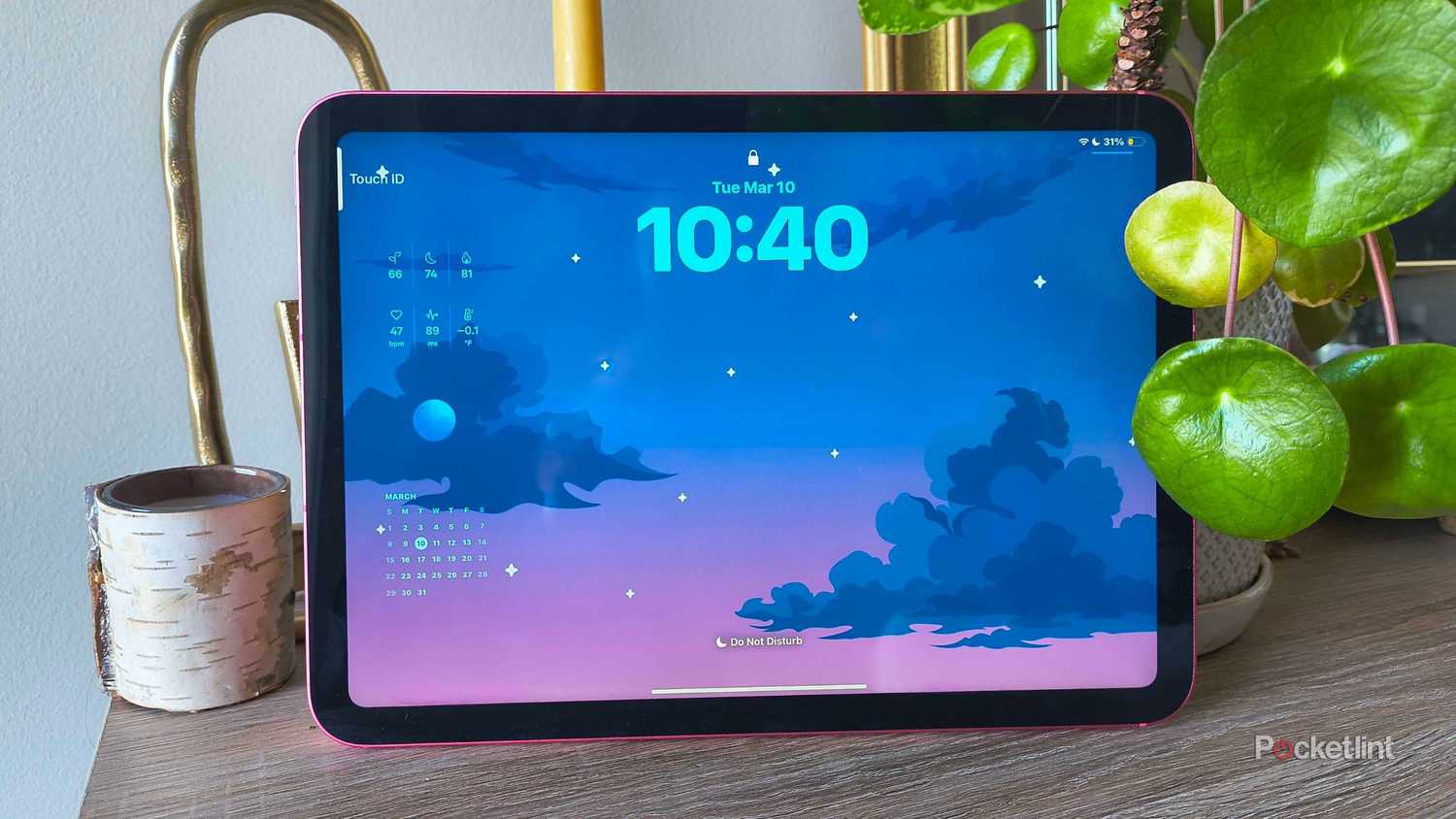 An iPad lockscreen with starry wallpaper.