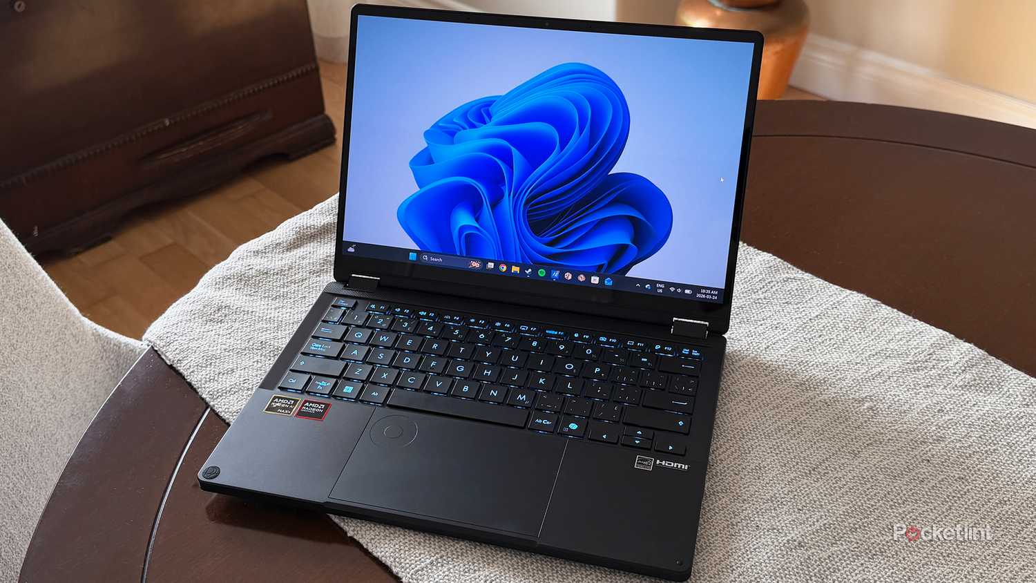 Windows 11 laptop on table.