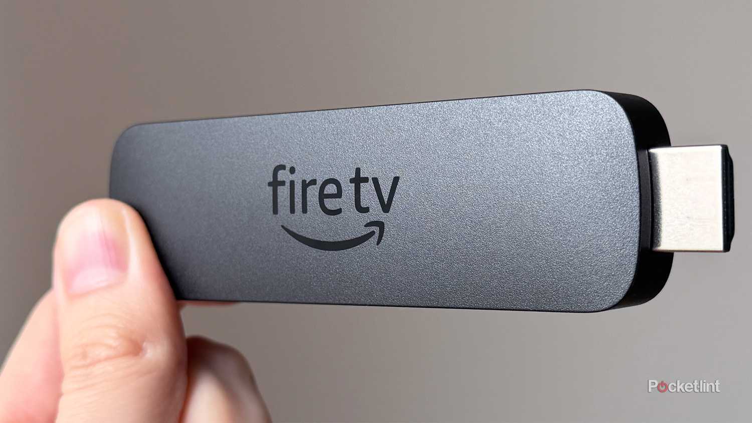 Person holding Fire TV Stick 4K Max.