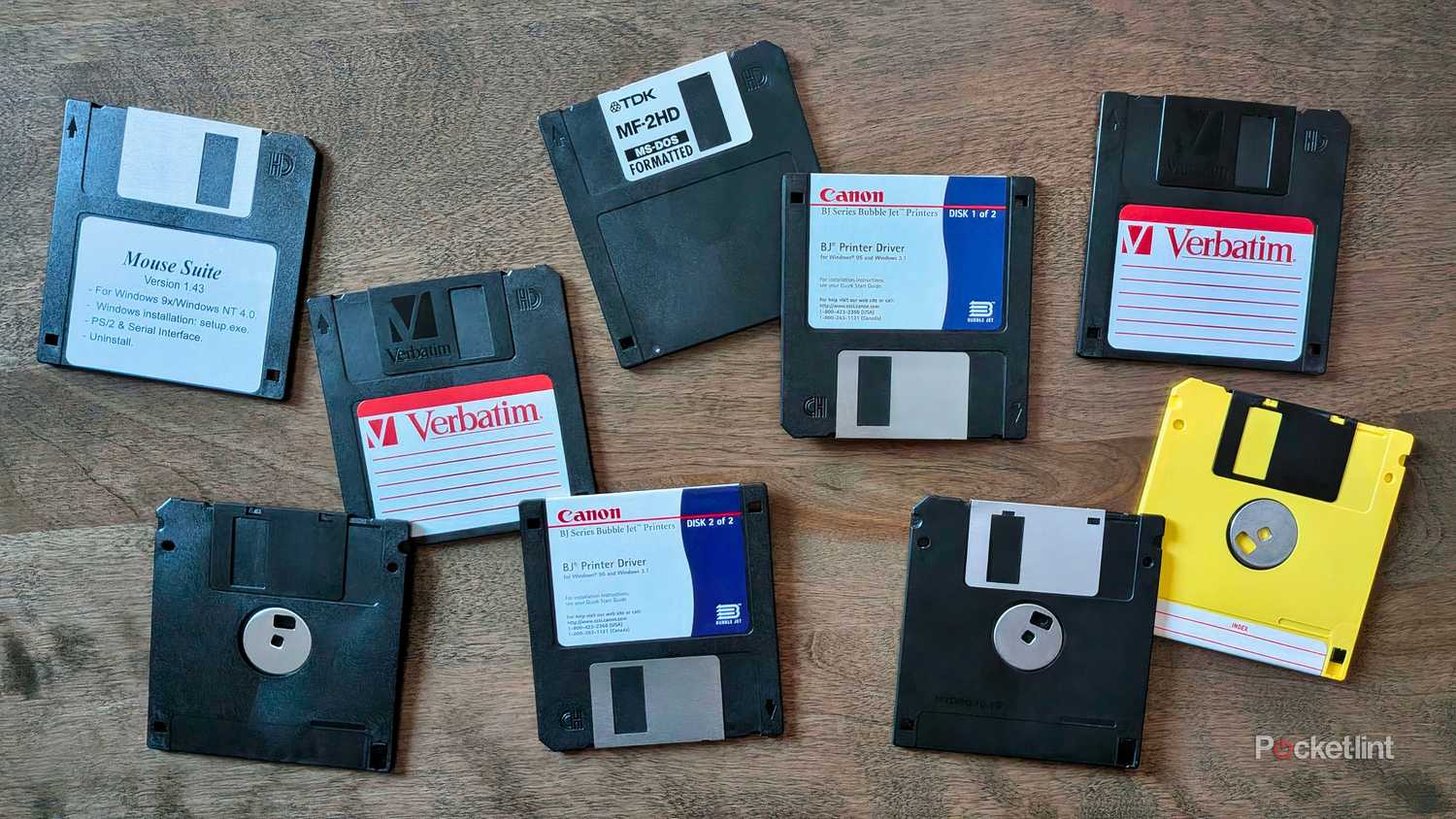 Various floppy disks spread out across a table.