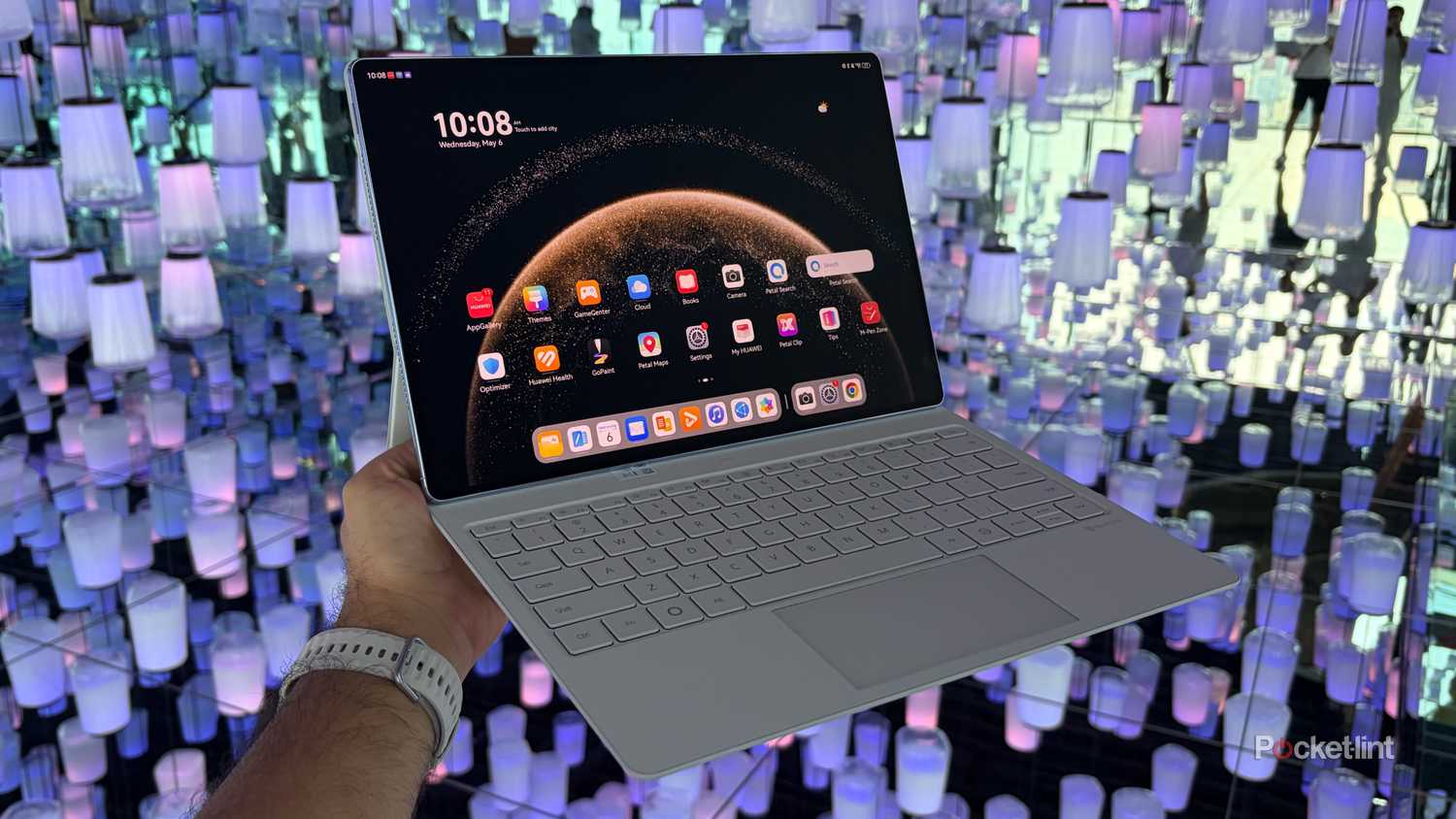 Holding the Huawei MatePad Pro Max with a single hand