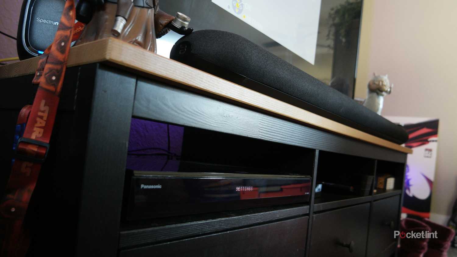 The Panasonic UB820-K Blu-ray player in an entertainment center.
