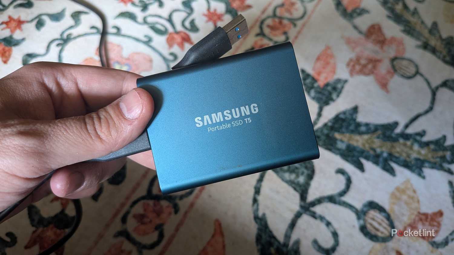 A blue portable Samsung SSD.