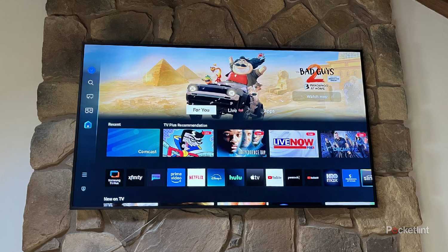 A Samsung smart TV mounted to the wall.