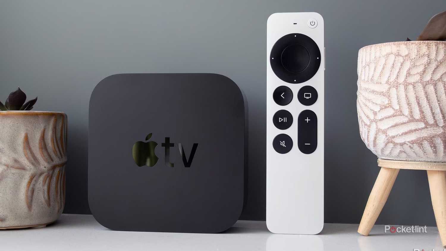 Apple TV 4K next to remote.