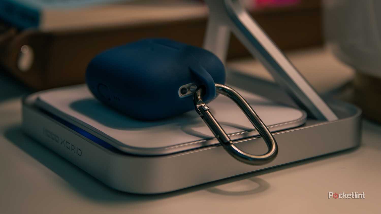 A still photo of the NOCO X-Grid charging a pair of AirPods.