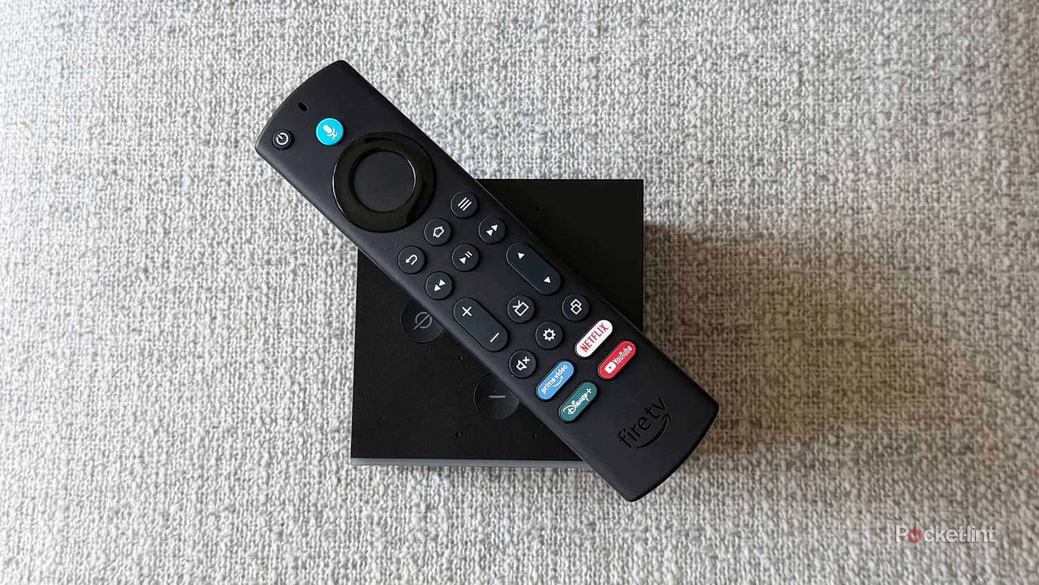 Fire TV Cube with remote on top.