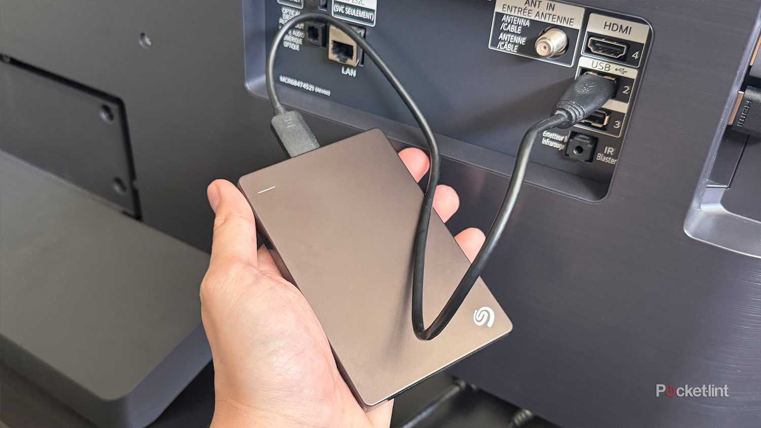 Portable hard drive plugged into LG TV USB port.
