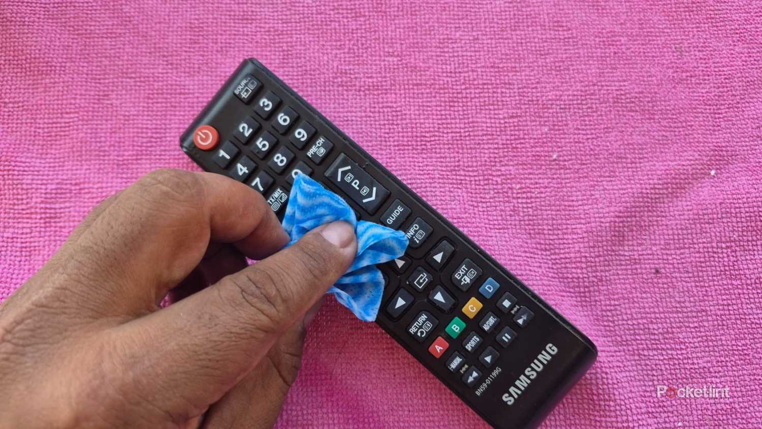 Cleaning a Samsung TV remote with a cloth
