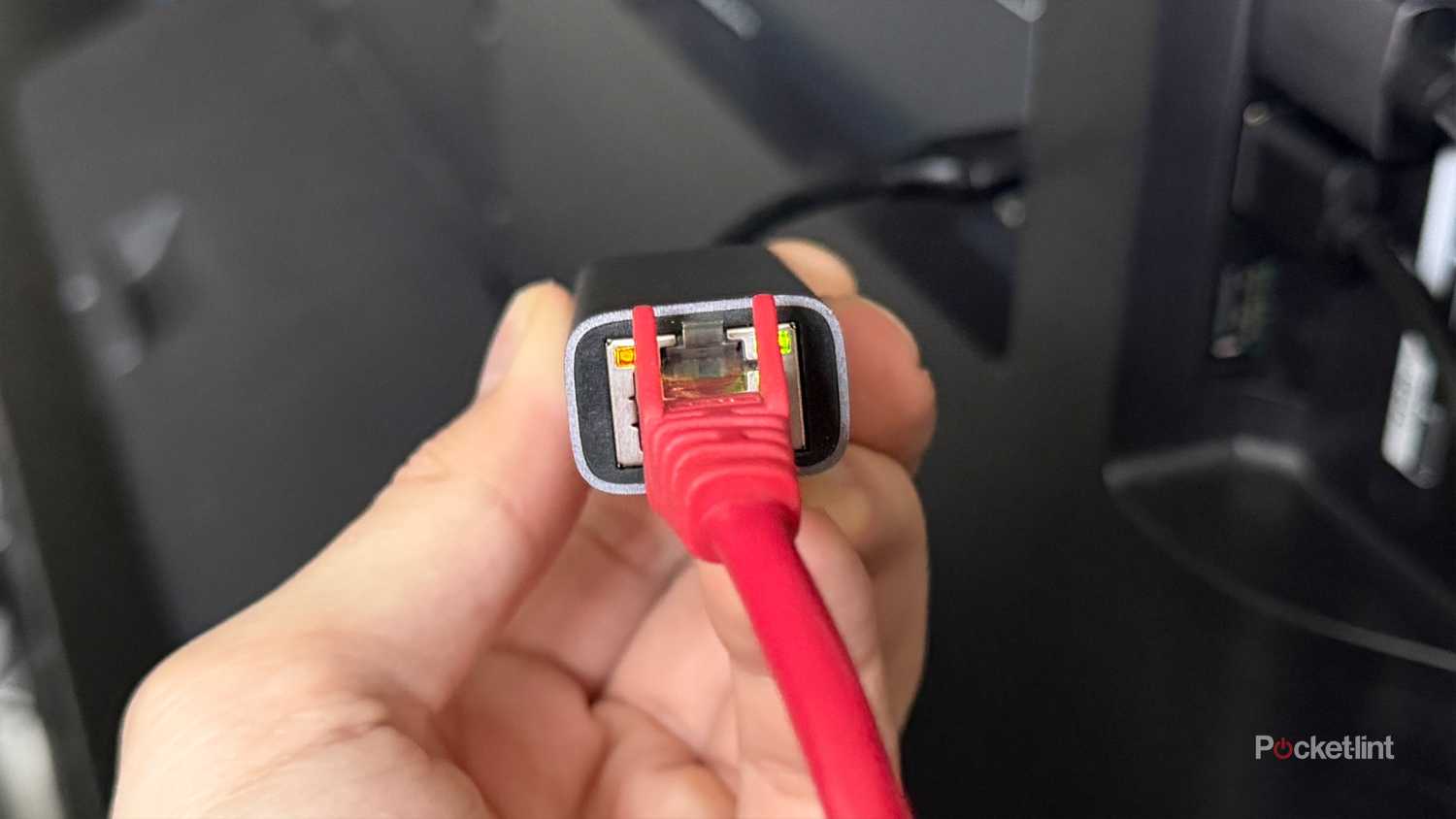 USB to Ethernet adapter plugged into TV.