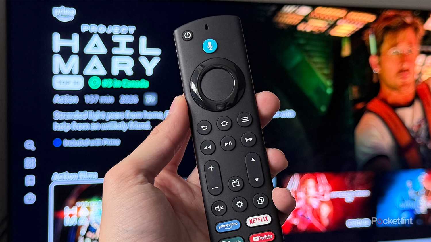 Person holding Fire TV remote.
