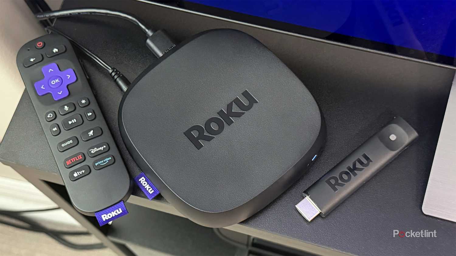 Roku Ultra and Roku Streaming Stick on TV unit.
