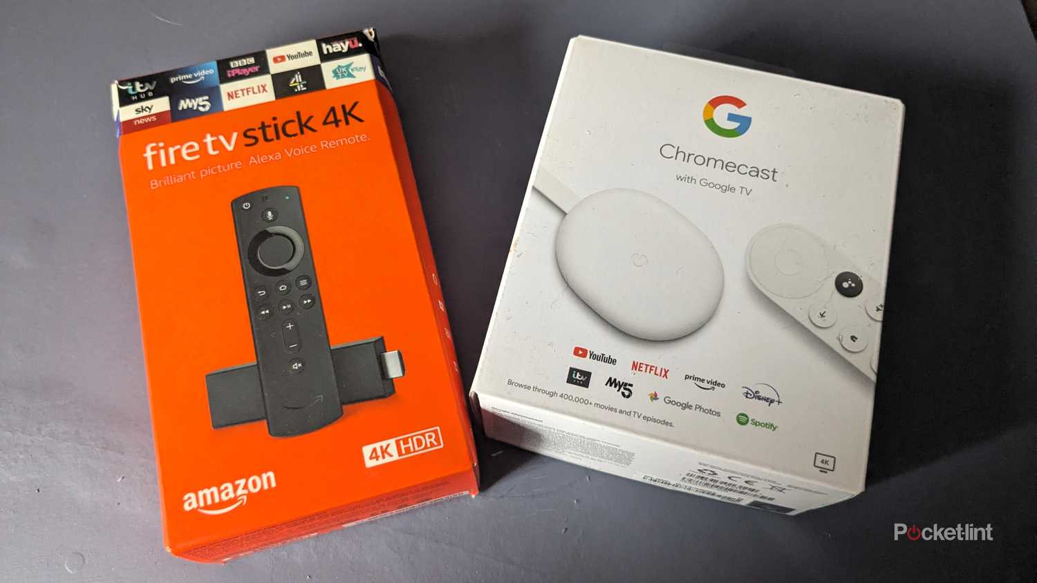 fire tv stick 4k and chromecast with google tv boxes side by side