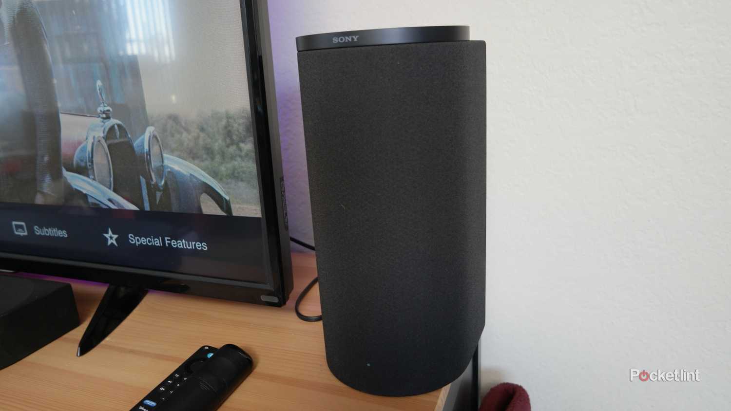 Sony Bravia Theater Trio right speaker on a TV table, next to a Fire TV