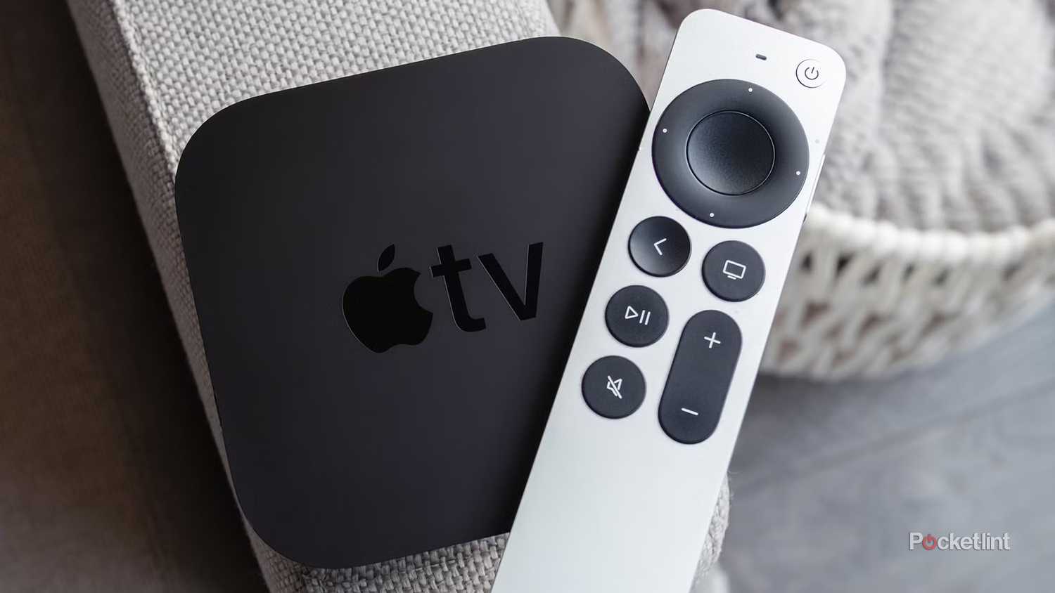 Apple TV 4K and Siri Remote on couch.