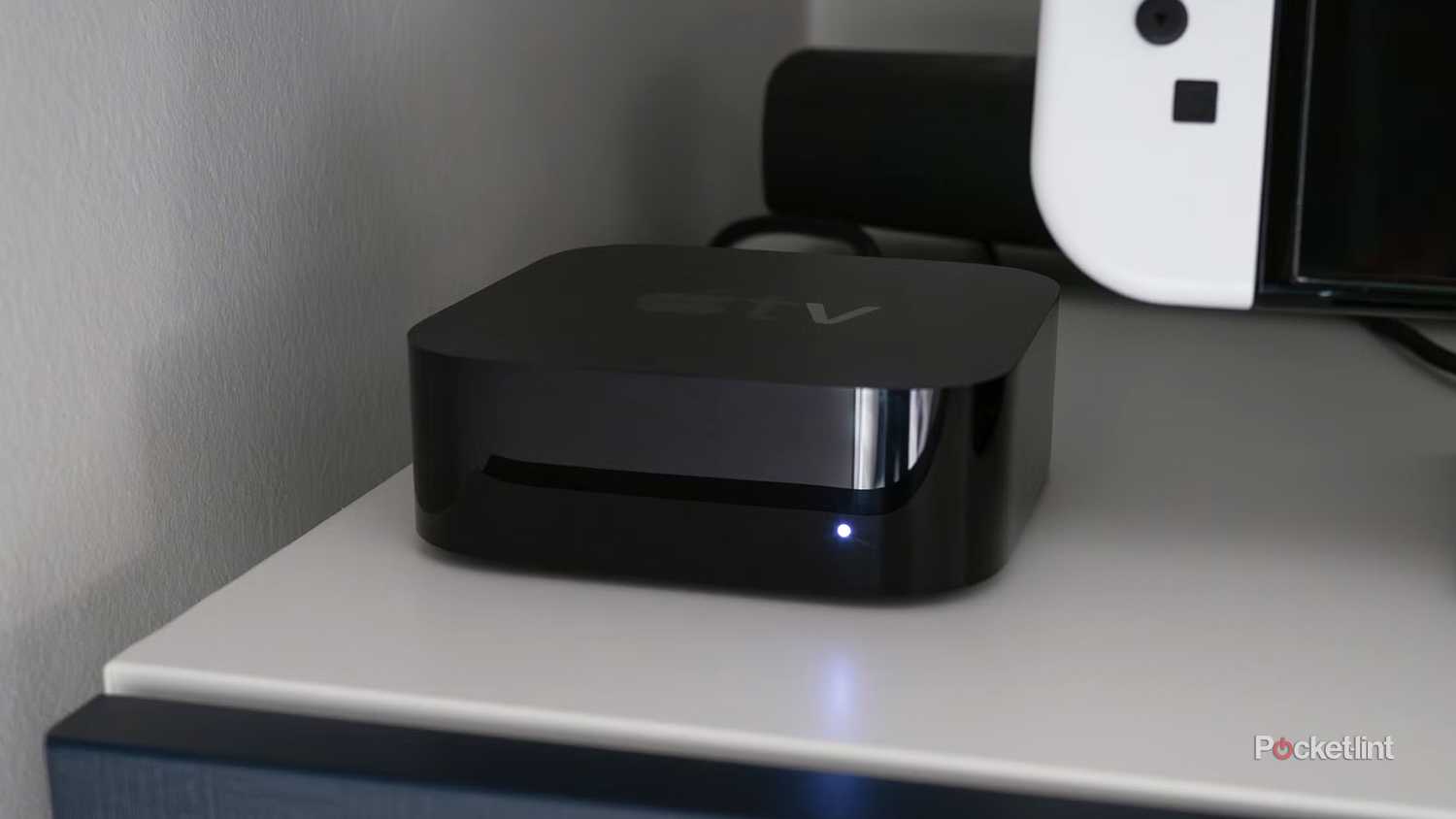 Apple TV 4K on TV unit.