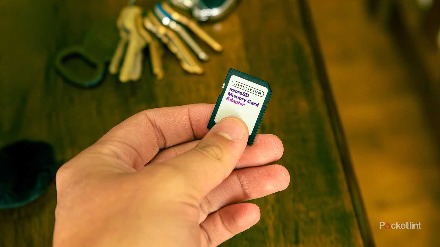 A still photo of someone holding an off-brand MicroSD card.