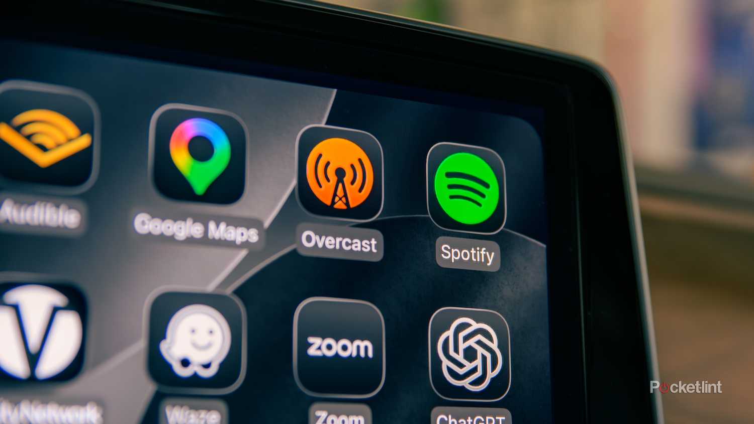 A still photo of the Spotify logo on an Apple CarPlay screen.