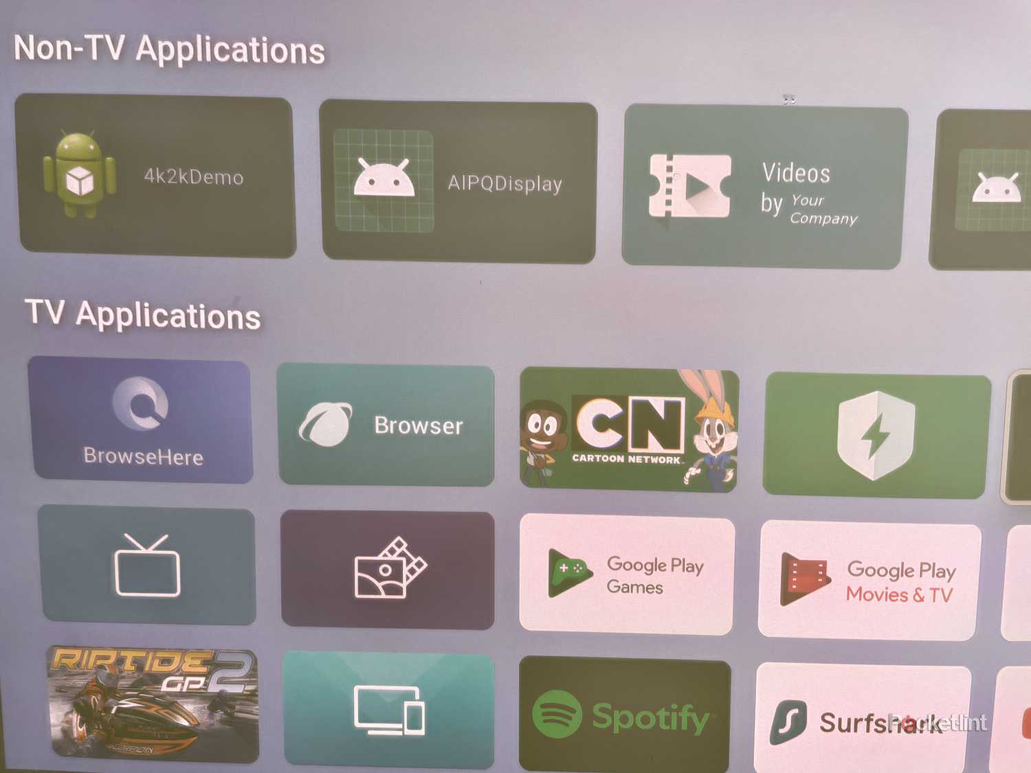 A layout of a home screen for a Smart TV, which includes various pre-installed apps. 