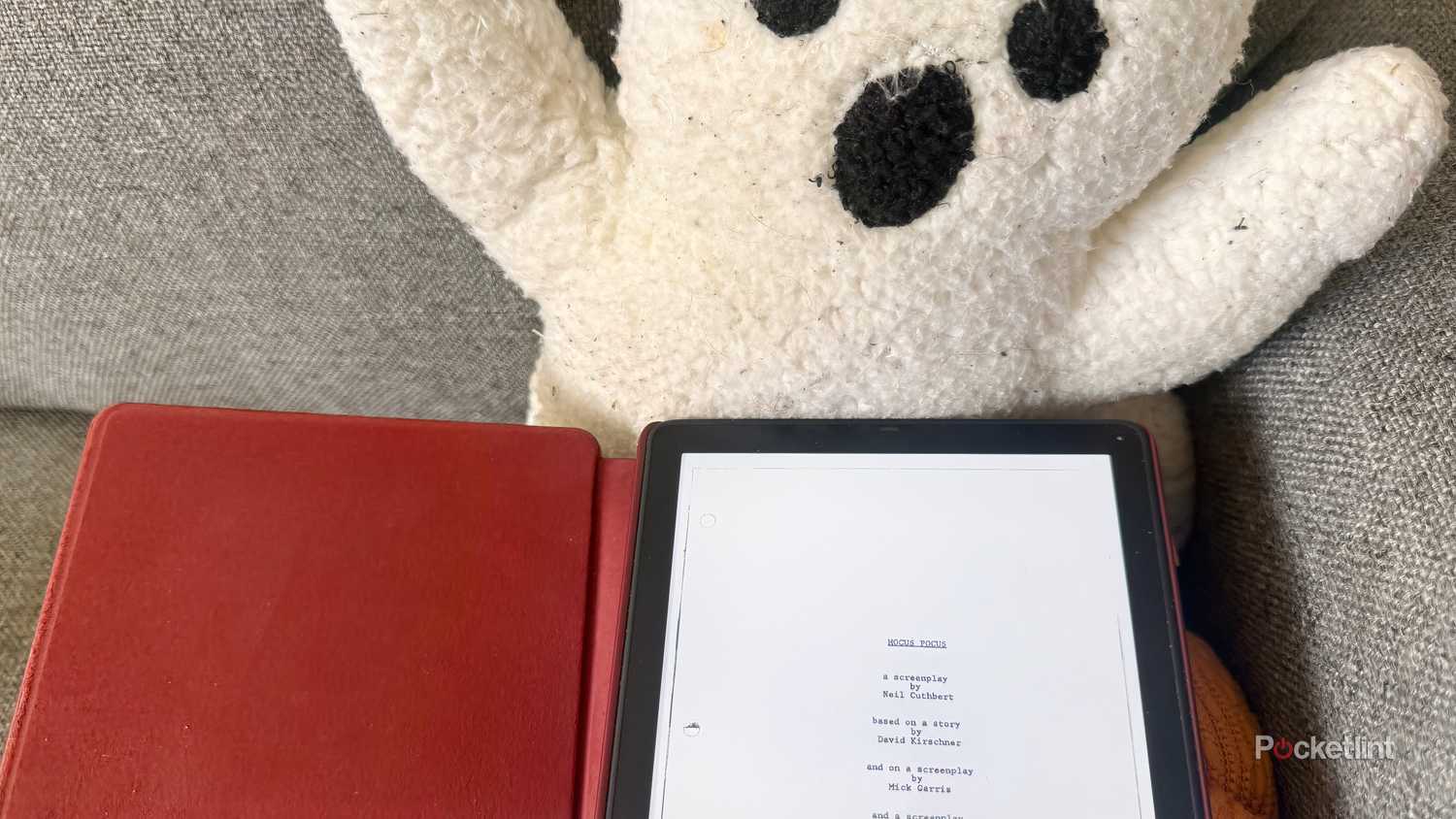 Kindle e-reader displaying script for Hocus Pocus in front of plush ghost.